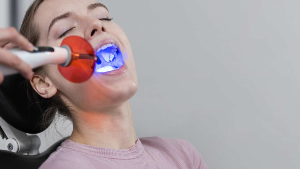 07 Teeth whitening procedure using LED light in a dental clinic