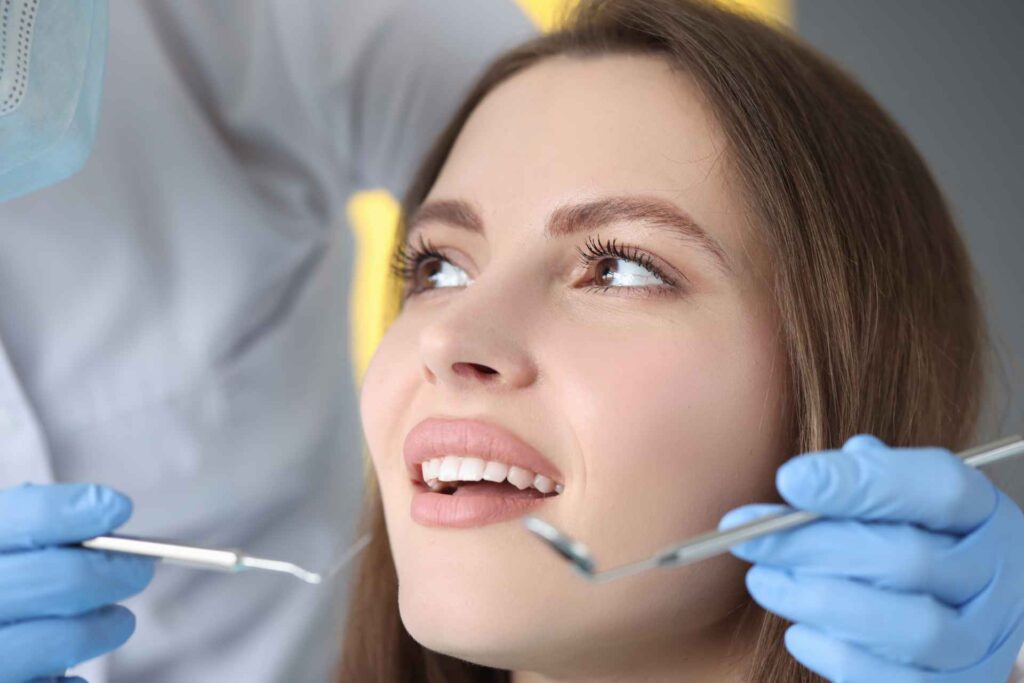 02 Girl during a normal dental exam in a clinic_How much veneers cost in Florida, Miami