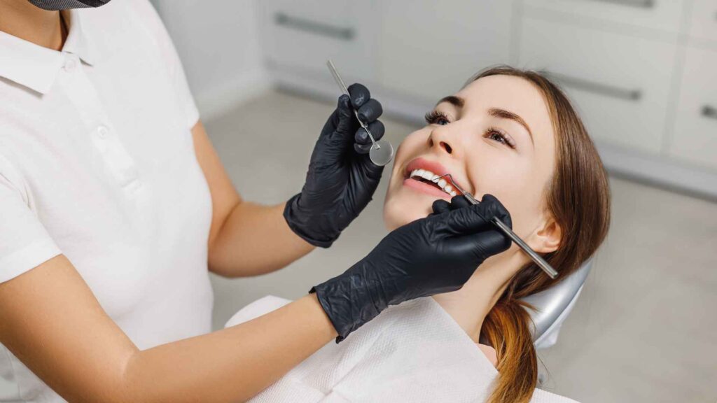 06 A woman undergoing a routine examination at a dental clinic