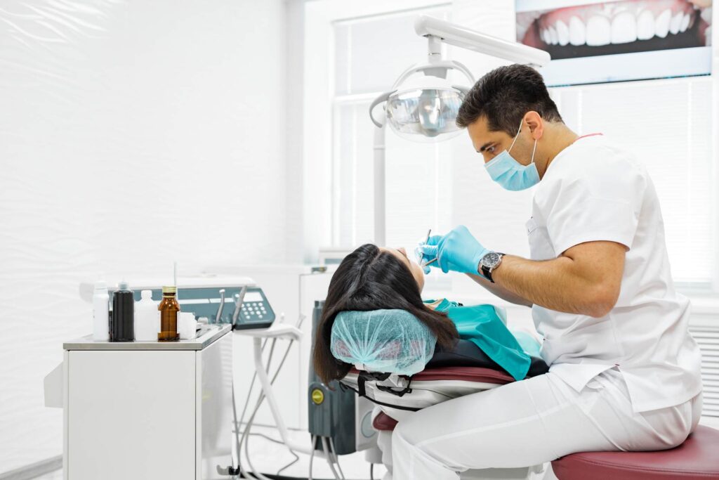 05 A woman receiving dental treatment in a day clinic_Porcelain veneers vs. bonding