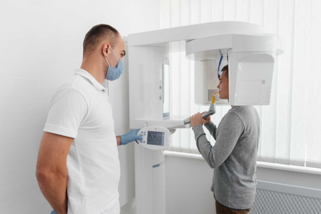 03 A young patient during a CT scan examination at a dental clinic_Recovery of dental implants, Dental implants in Miami