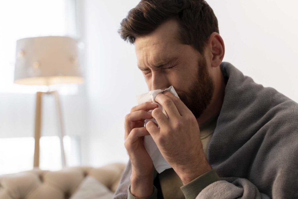 06 An adult male during sinusitis or a cold_Recovery of dental implants, Dental Implants in Miami