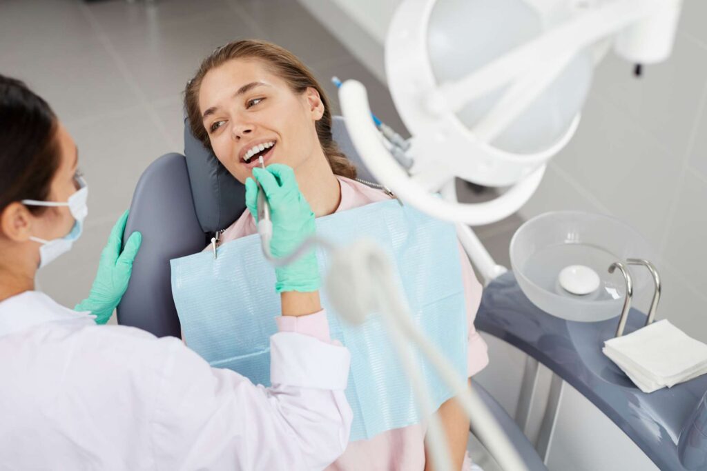 15 A girl during a dental procedure in a dental clinic_Types of dental implants