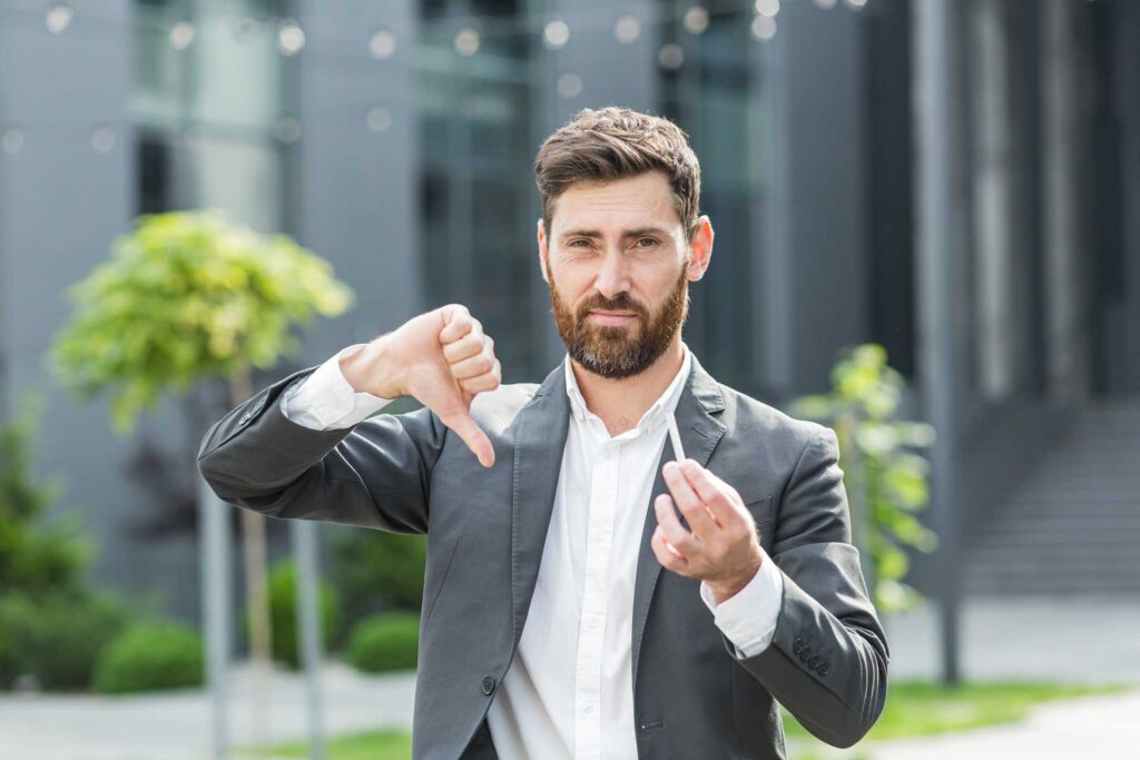 06 Man dislikes a cigarette thumbs down gesture