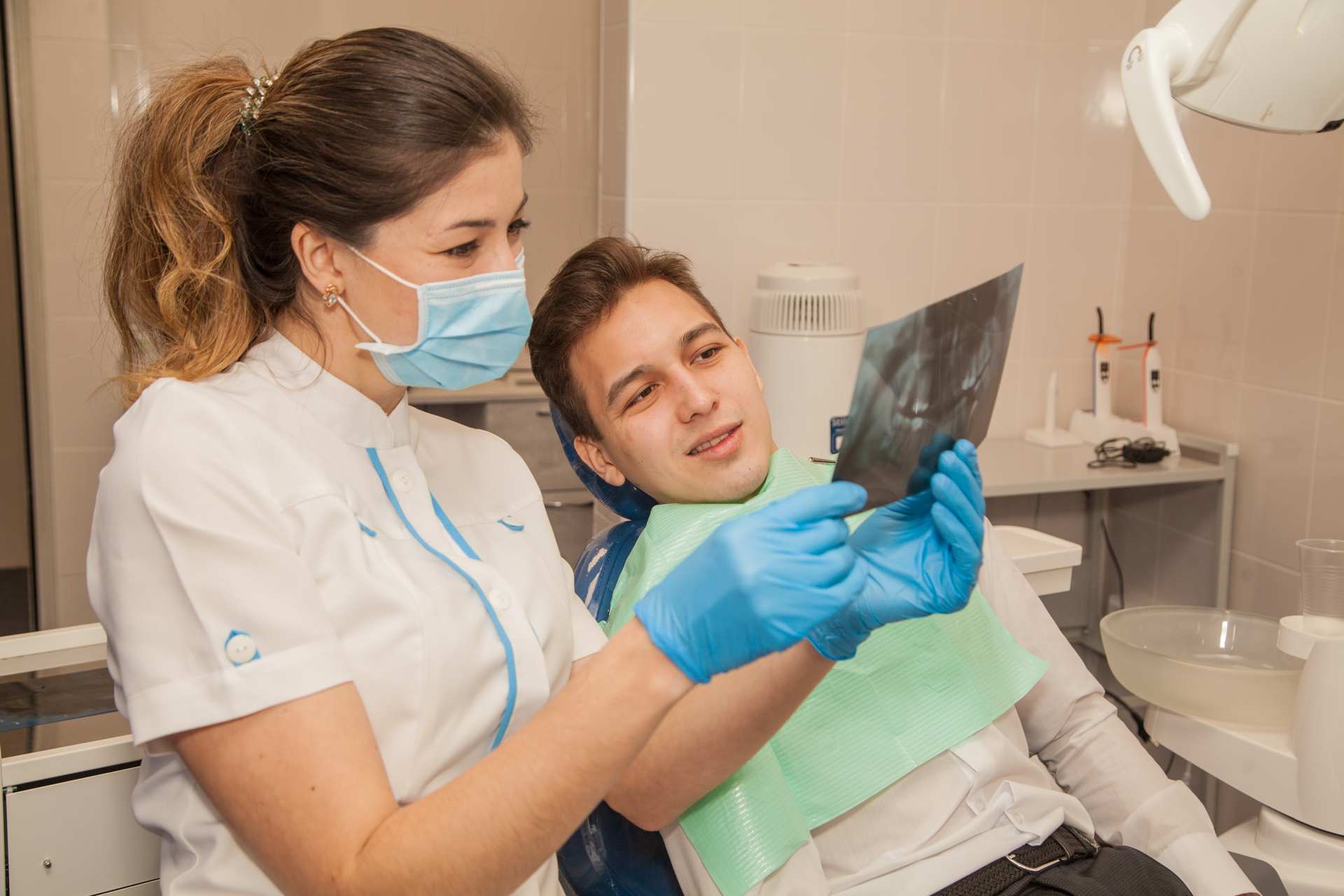 15 Dentist checking a patient's x-ray film